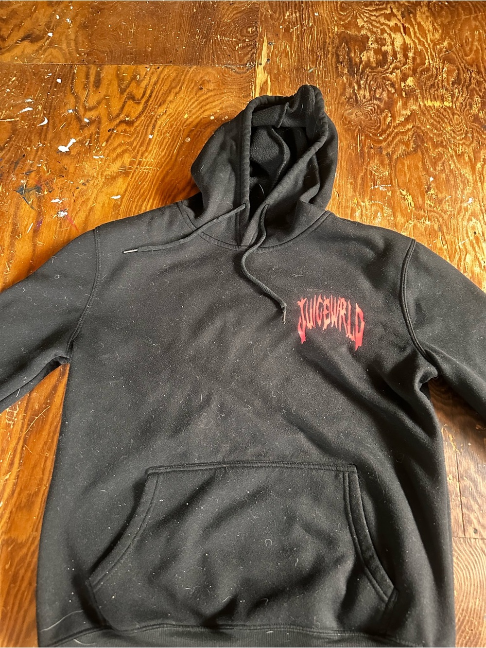 Genuine Merchandise Black Hoodie with Red Graphic